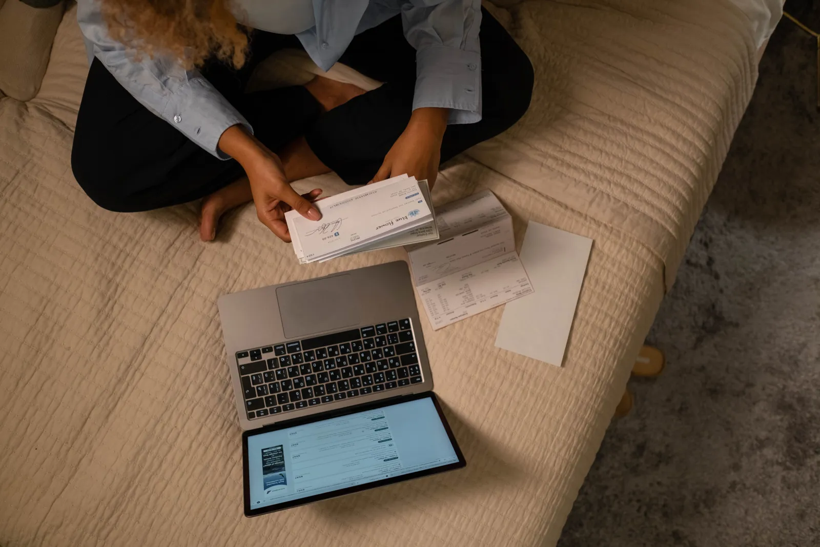 Person comparing checking and savings account options on a laptop, 2026 banking guide