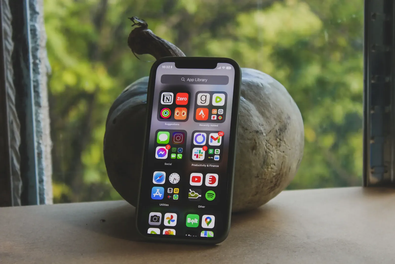 comparing investment app icons and features on a smartphone